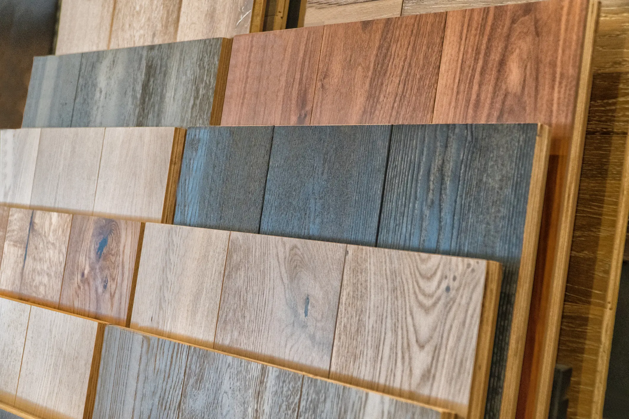 Various wood flooring samples in different colors and textures.